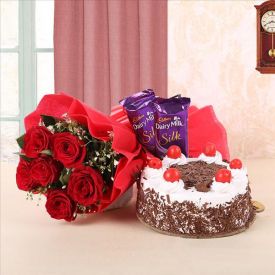 Bunch of red roses, black forest cake and dairy milk