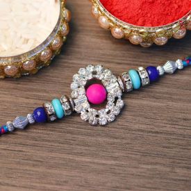 Ferrero Rocher with a beautiful stone studded golden Rakhi