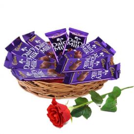 Basket of dairy milk chocolate with red rose