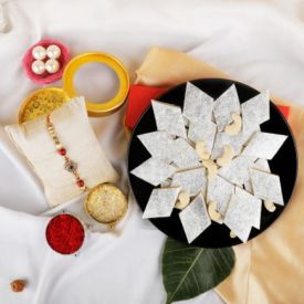 1 kg kaju Barfi and 3 Rakhi