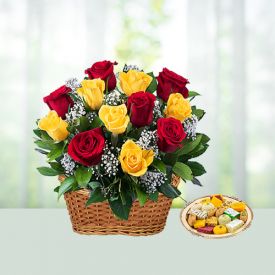 Basket of mixed roses with sweets