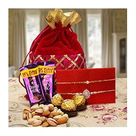 Chocolates to a Designer Potli Bag full of mixed dryfruits Dairy Milk chocolates