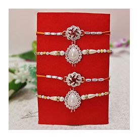 4 Rakhis, 2 Silver Stone Studded Rakhis ,2 Pearl Rakhis