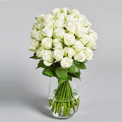 white roses with vase