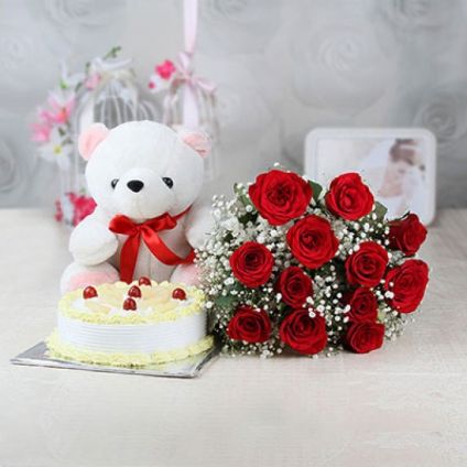 A bunch of 20 pink roses 1 kg pineapple cake and white 12- inch- teddy .