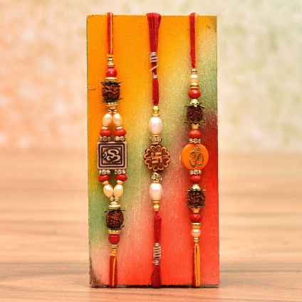 Pearl Rakhi and 2 beautifully crafted Stone Studded Rakhis.