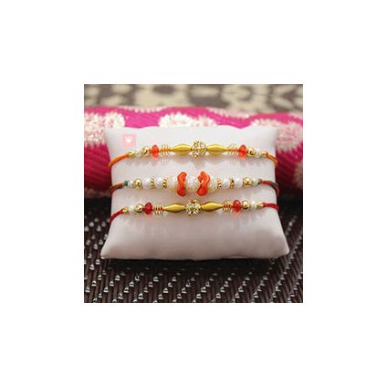 Beautiful Pearl Rakhi along with two Beaded Rakhi