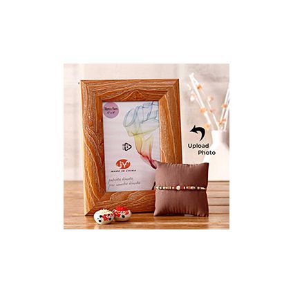 Personalized wooden border frame with lovely rakhi.