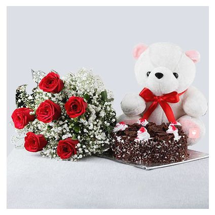 10 Red Roses and Heart Shaped Black Forest Cake with a Teddy Bear