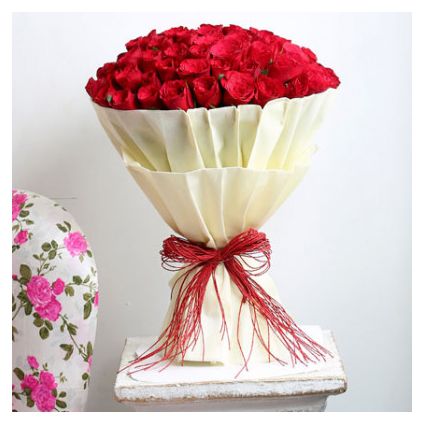 Bunch of 30 red roses with paper packing