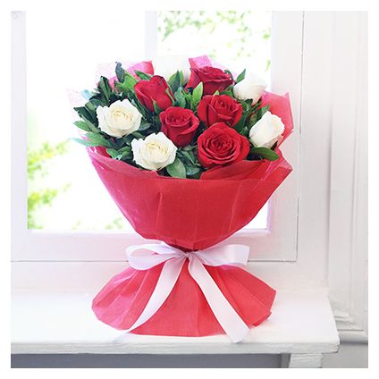 Bunch of 15 red and white roses with paper packing