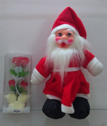 Santa Claus with artificial red Rose